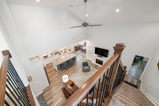 5540 Eva Loop S, Dublin, OH 43016 - living area with wood finished floors, ceiling fan, recessed lighting, and high vaulted ceiling