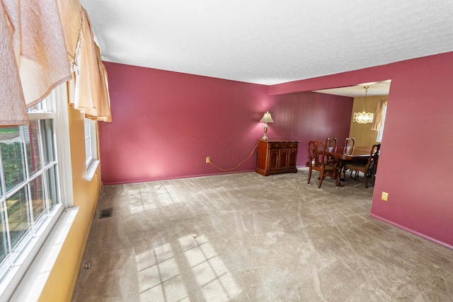 5500 Saddlebrook Dr, Columbus, OH 43221 - unfurnished living room featuring a chandelier and carpet floors