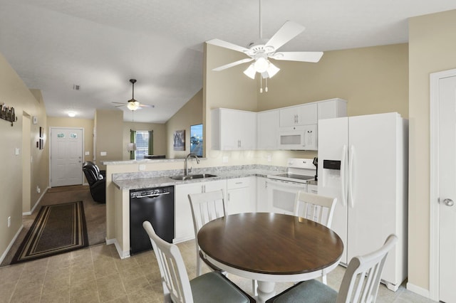 3991 Shannon Green Dr Unit 152, Canal Winchester, OH 43110 - kitchen with white appliances, a ceiling fan, white cabinets, a peninsula, and light tile patterned floors