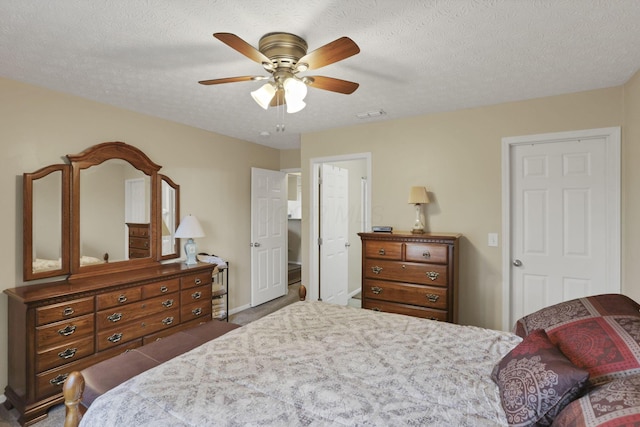3991 Shannon Green Dr Unit 152, Canal Winchester, OH 43110 - carpeted bedroom featuring a textured ceiling and a ceiling fan