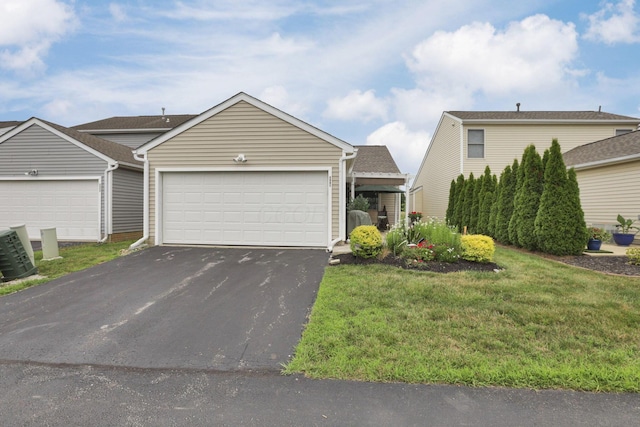 3991 Shannon Green Dr Unit 152, Canal Winchester, OH 43110 - ranch-style home with asphalt driveway, a front yard, and an attached garage