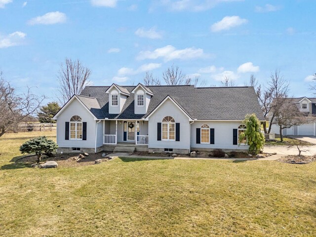 5583 Durrett Rd, Orient, OH 43146 - new england style home with covered porch, a front yard, and a shingled roof