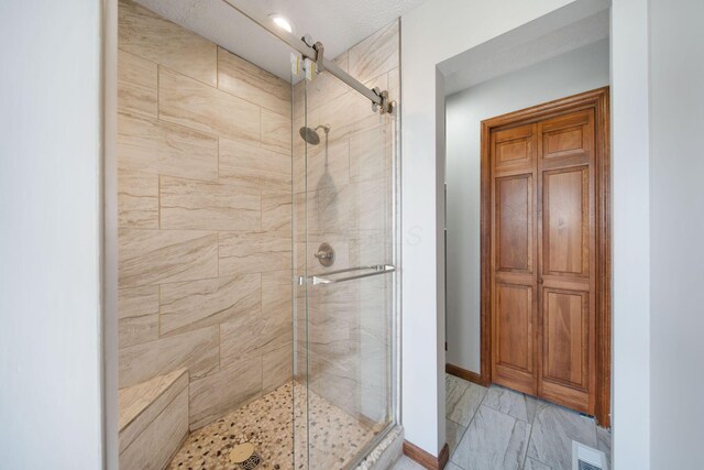 5583 Durrett Rd, Orient, OH 43146 - bathroom with a stall shower and marble finish flooring