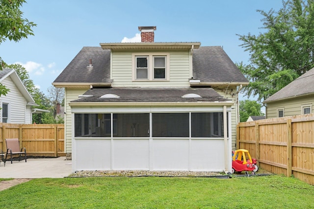105 Marks Ave, Lancaster, OH 43130 - back of house featuring a sunroom, a chimney, a patio, and a fenced backyard