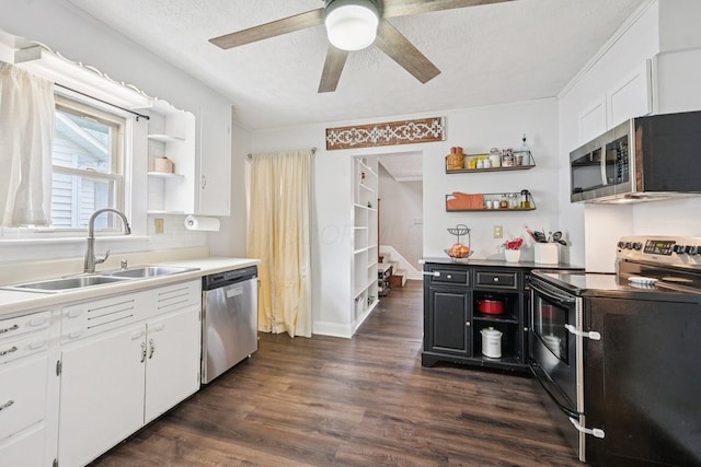 105 Marks Ave, Lancaster, OH 43130 - kitchen with appliances with stainless steel finishes, open shelves, white cabinetry, ceiling fan, and dark wood finished floors