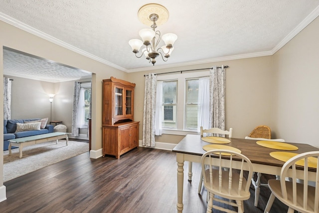 105 Marks Ave, Lancaster, OH 43130 - dining room featuring dark wood-style floors, a chandelier, a textured ceiling, and crown molding