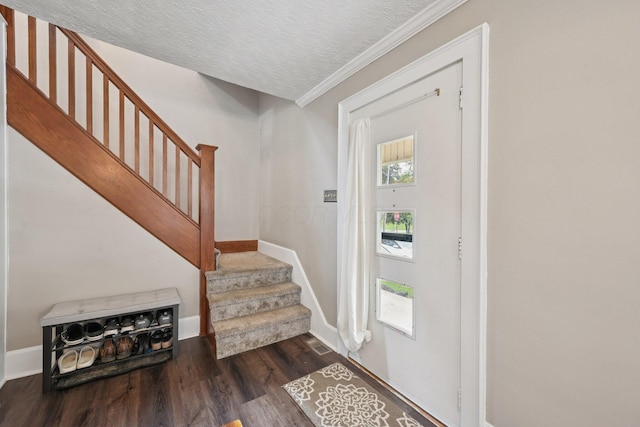 105 Marks Ave, Lancaster, OH 43130 - foyer with stairs, dark wood-style floors, a textured ceiling, and ornamental molding