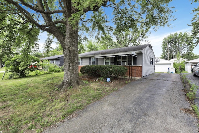 1535 S Hamilton Rd, Columbus, OH 43227 - ranch-style home featuring brick siding, a front lawn, a detached garage, and an outbuilding