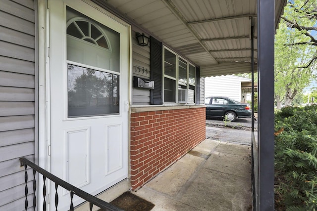 1535 S Hamilton Rd, Columbus, OH 43227 - doorway to property with brick siding and a carport