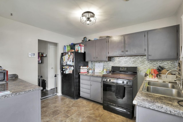 1535 S Hamilton Rd, Columbus, OH 43227 - kitchen with black appliances, gray cabinets, and tasteful backsplash