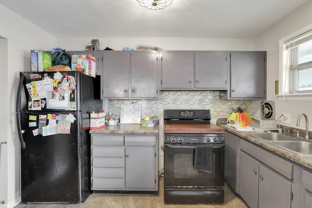 1535 S Hamilton Rd, Columbus, OH 43227 - kitchen with black appliances, gray cabinetry, tasteful backsplash, and light countertops
