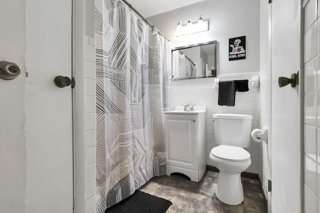 1535 S Hamilton Rd, Columbus, OH 43227 - bathroom featuring vanity, tile walls, a shower with curtain, and wainscoting