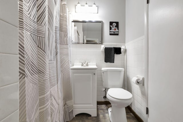 1535 S Hamilton Rd, Columbus, OH 43227 - full bathroom with tile walls, vanity, wainscoting, and a shower with shower curtain