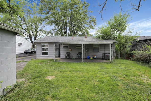 1535 S Hamilton Rd, Columbus, OH 43227 - rear view of house with a patio area and a lawn