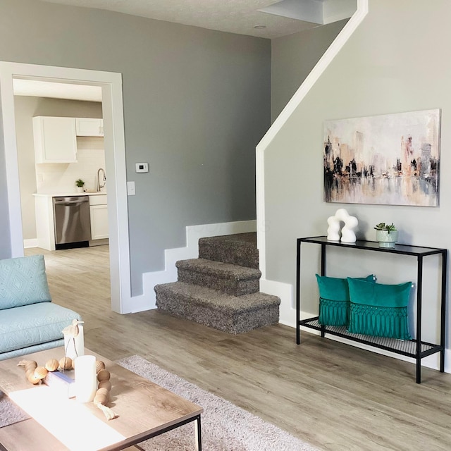 652 E 6th Ave, Lancaster, OH 43130 - living room featuring light wood-type flooring and stairway