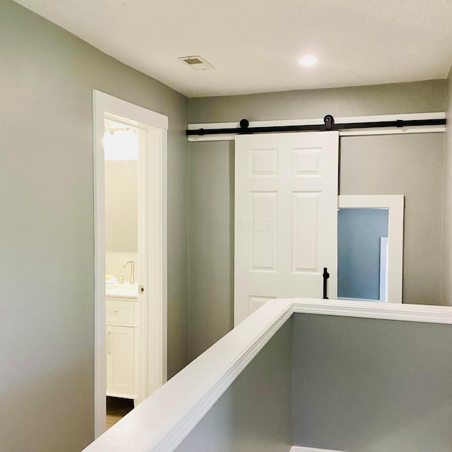 652 E 6th Ave, Lancaster, OH 43130 - hall featuring a barn door and recessed lighting