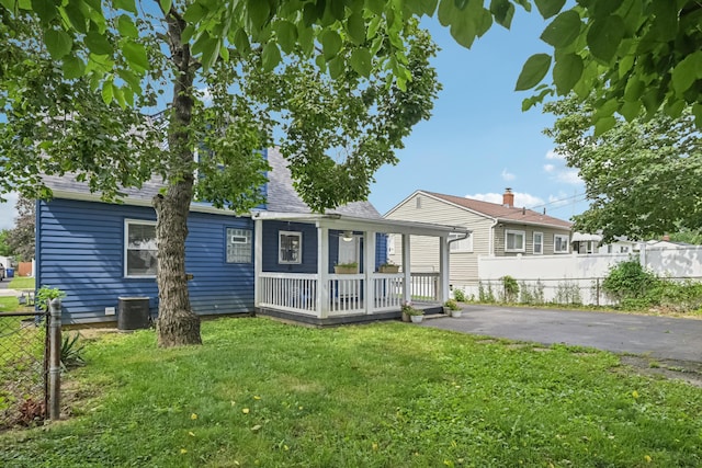2931 Templeton Rd, Columbus, OH 43209 - back of house featuring a porch and asphalt driveway
