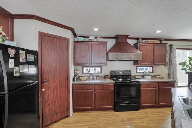 2445 Columbus-Lancaster Rd NW Unit 248Hickory, Lancaster, OH 43130 - kitchen with black appliances, premium range hood, tile counters, ornamental molding, and light wood finished floors