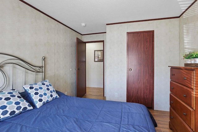 2445 Columbus-Lancaster Rd NW Unit 248Hickory, Lancaster, OH 43130 - bedroom with ornamental molding and wood finished floors