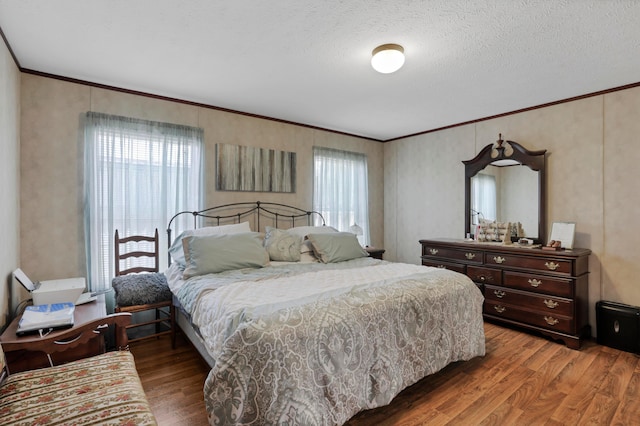 2445 Columbus-Lancaster Rd NW Unit 248Hickory, Lancaster, OH 43130 - bedroom featuring crown molding, wood finished floors, multiple windows, and a textured ceiling