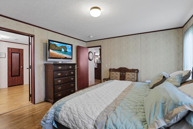 2445 Columbus-Lancaster Rd NW Unit 248Hickory, Lancaster, OH 43130 - bedroom featuring wood finished floors, ornamental molding, and a textured ceiling