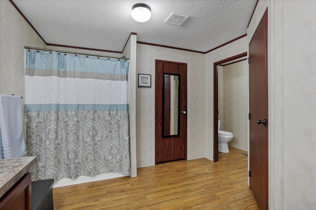 2445 Columbus-Lancaster Rd NW Unit 248Hickory, Lancaster, OH 43130 - full bath with crown molding, wood finished floors, a textured ceiling, vanity, and a shower with shower curtain