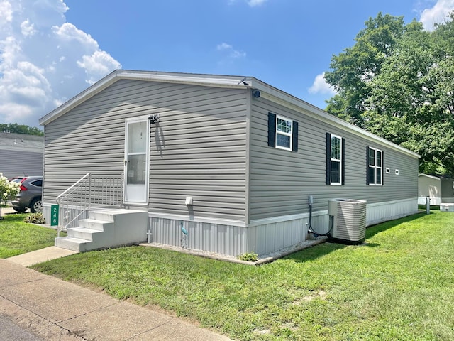 2445 Columbus-Lancaster Rd NW Unit 248Hickory, Lancaster, OH 43130 - view of property exterior featuring a cooling unit and a lawn