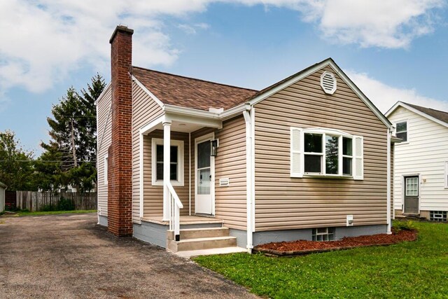 205 N Gould Rd, Columbus, OH 43209 - view of front of house with a chimney and driveway