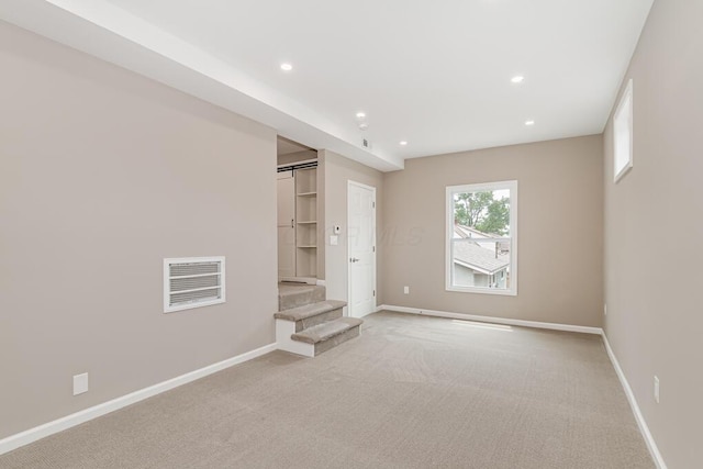 205 N Gould Rd, Columbus, OH 43209 - unfurnished bedroom with light colored carpet and recessed lighting