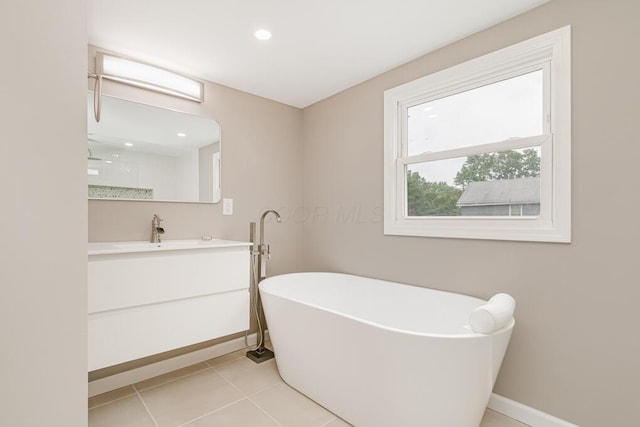205 N Gould Rd, Columbus, OH 43209 - bathroom featuring a freestanding bath, vanity, tile patterned floors, recessed lighting, and a shower