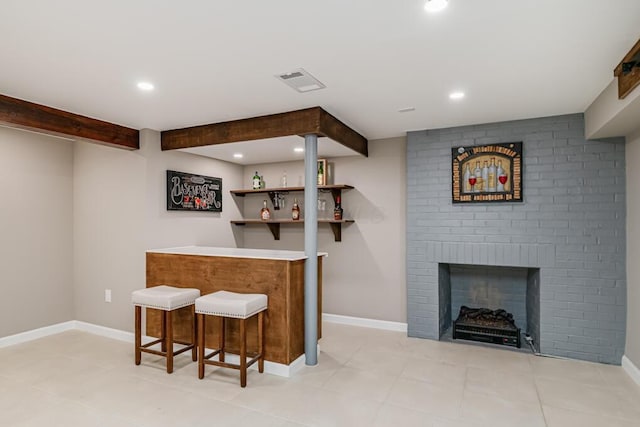 205 N Gould Rd, Columbus, OH 43209 - indoor dry bar featuring recessed lighting, a brick fireplace, and light tile patterned floors