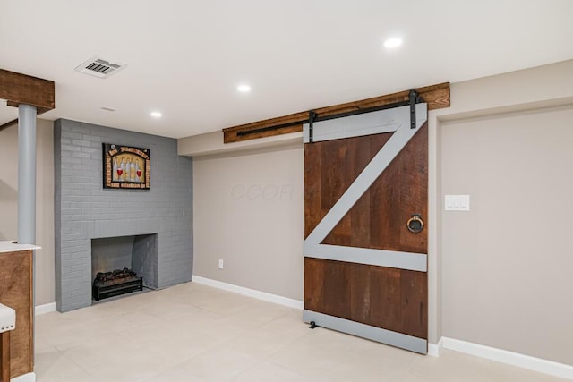 205 N Gould Rd, Columbus, OH 43209 - finished below grade area featuring a brick fireplace, recessed lighting, and a barn door