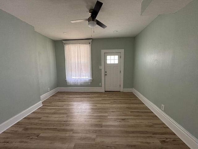 1345 E Livingston Ave Unit 1347, Columbus, OH 43205 - foyer entrance featuring a ceiling fan, wood finished floors, and a textured ceiling