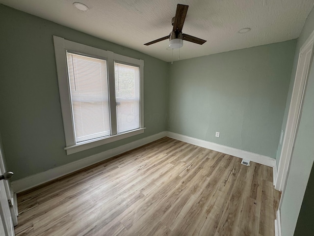 1345 E Livingston Ave Unit 1347, Columbus, OH 43205 - unfurnished room with light wood-type flooring, a ceiling fan, and a textured ceiling