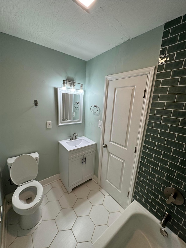 1345 E Livingston Ave Unit 1347, Columbus, OH 43205 - bathroom with vanity, tile patterned flooring, and a textured ceiling