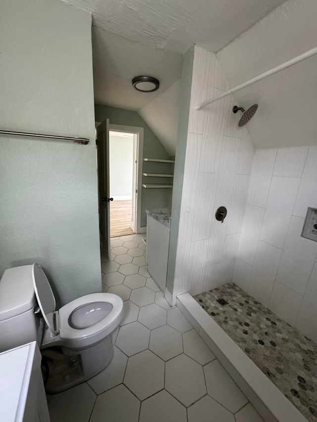 1345 E Livingston Ave Unit 1347, Columbus, OH 43205 - bathroom featuring vaulted ceiling, a shower stall, and tile patterned floors