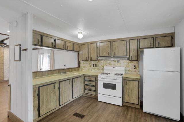 19 E 1st St, The Plains, OH 45780 - kitchen with white appliances, under cabinet range hood, light countertops, and dark wood-style floors
