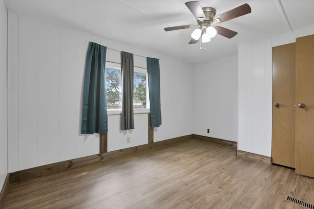 19 E 1st St, The Plains, OH 45780 - unfurnished bedroom with wood finished floors and a ceiling fan