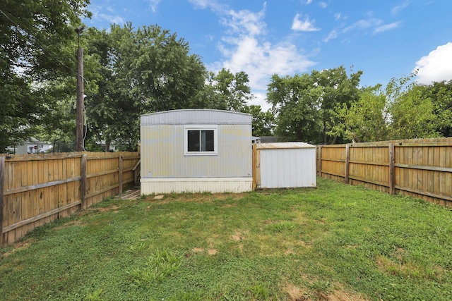 19 E 1st St, The Plains, OH 45780 - fenced backyard featuring a shed and view of scattered trees