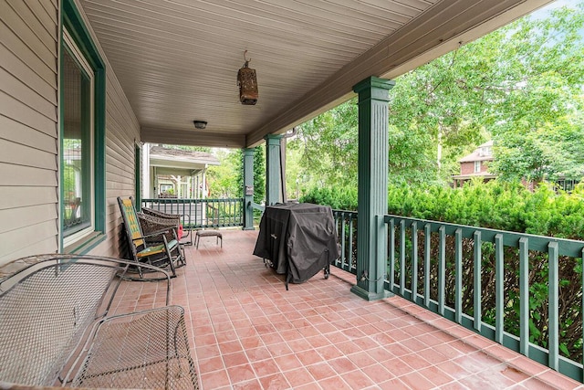 2521 Glenmawr Ave, Columbus, OH 43202 - covered porch with a grill