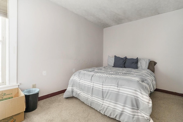 2521 Glenmawr Ave, Columbus, OH 43202 - carpeted bedroom with a textured ceiling