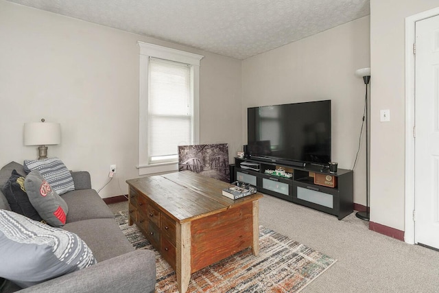 2521 Glenmawr Ave, Columbus, OH 43202 - living room with carpet flooring and a textured ceiling