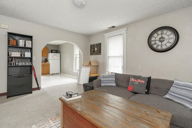 2521 Glenmawr Ave, Columbus, OH 43202 - living room featuring arched walkways and carpet
