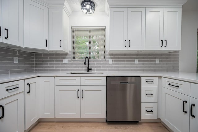 260 Old Coach Pl, Canal Winchester, OH 43110 - kitchen with dishwasher, light countertops, and white cabinetry