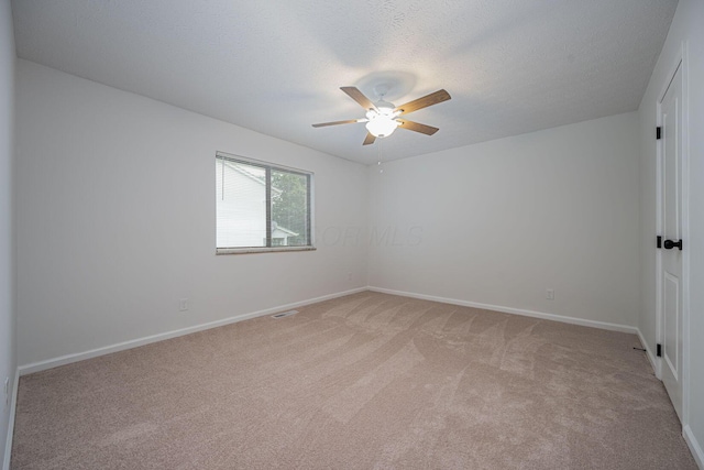 260 Old Coach Pl, Canal Winchester, OH 43110 - empty room featuring light colored carpet, ceiling fan, and a textured ceiling