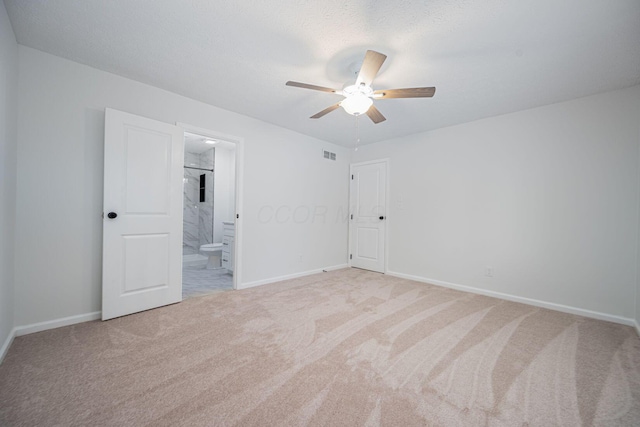 260 Old Coach Pl, Canal Winchester, OH 43110 - unfurnished bedroom featuring light carpet, connected bathroom, and a ceiling fan