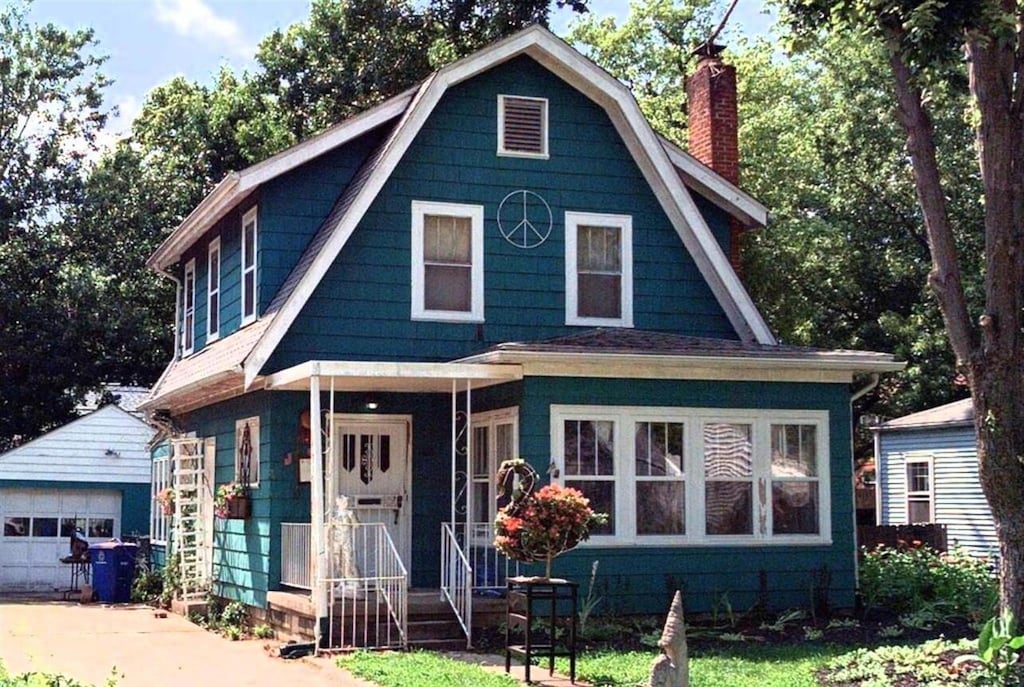 811 S Chesterfield Rd, Columbus, OH 43209 - colonial inspired home featuring a chimney, an outbuilding, a gambrel roof, and a garage
