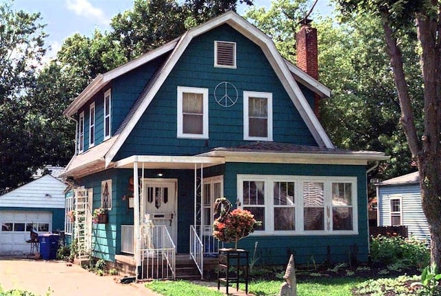 811 S Chesterfield Rd, Columbus, OH 43209 - colonial inspired home featuring a chimney, an outbuilding, a gambrel roof, and a garage