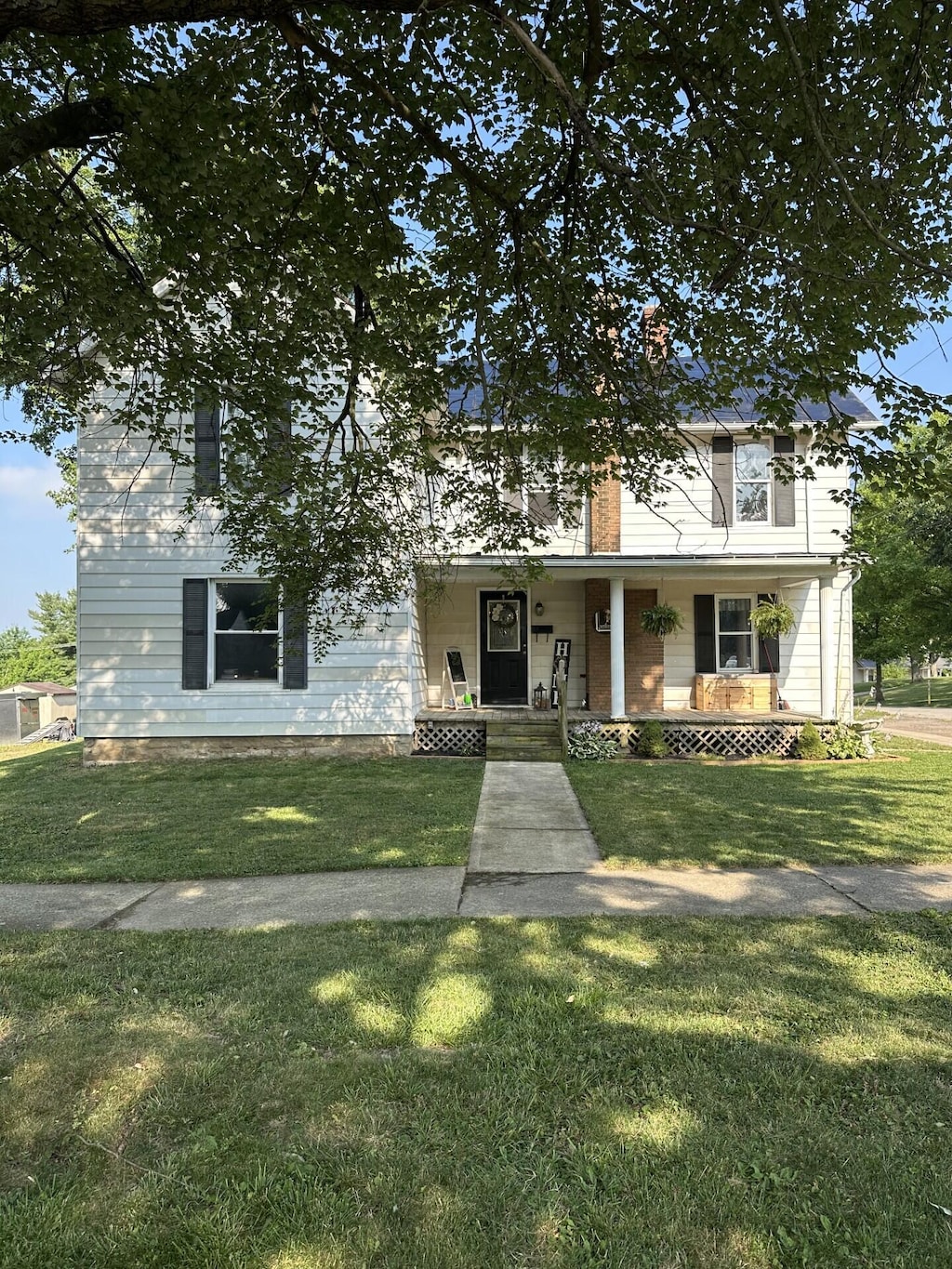 123 N Cherry St, Mount Gilead, OH 43338 - view of front of home featuring a porch and a front lawn