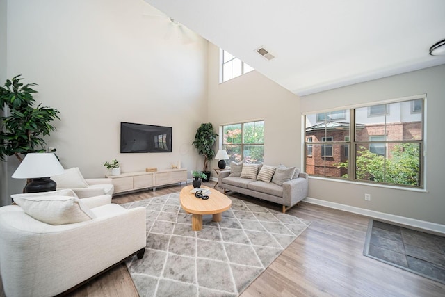 29 Victorian Gate Way, Columbus, OH 43215 - living area featuring wood finished floors and a towering ceiling